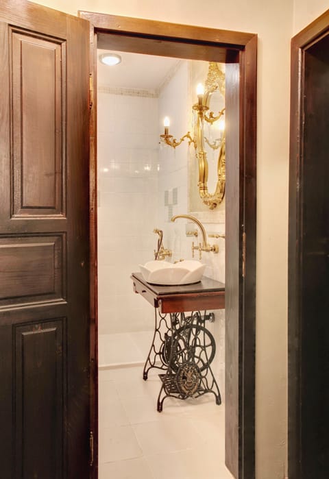 Shower, designer toiletries, hair dryer, slippers