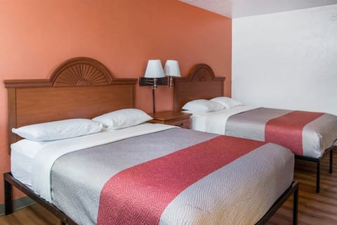 Desk, laptop workspace, bed sheets