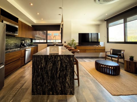 Deluxe Studio Suite | Living area | 55-inch Smart TV with digital channels, Netflix, streaming services