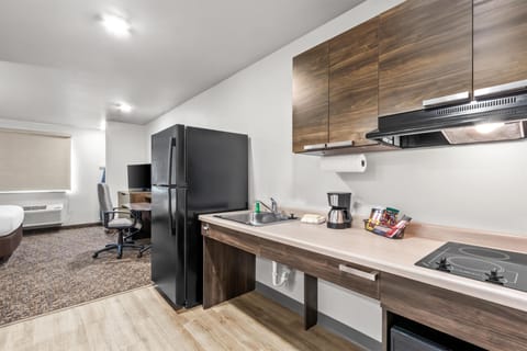 Room, 1 Queen Bed, Mobility Accessible (Hearing Impaired, Roll In Shower) | Private kitchenette | Full-size fridge, microwave, stovetop, coffee/tea maker