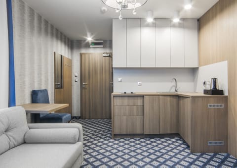 Studio Suite | Living room | 32-inch LCD TV with cable channels, TV