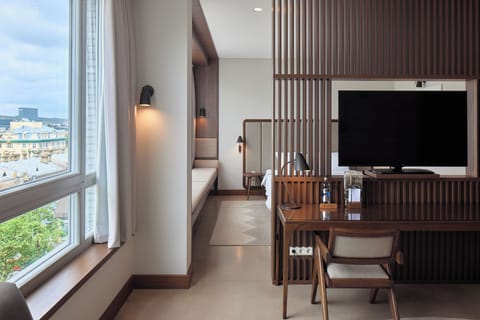 Studio Suite | Living area | 49-inch LED TV with satellite channels, TV, heated floors