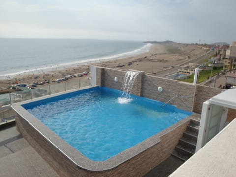Seasonal outdoor pool, open 9:00 AM to 10:00 PM, pool umbrellas