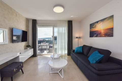 Deluxe Apartment, 3 Bedrooms, Non Smoking, Terrace | Living area | 45-inch flat-screen TV with satellite channels, TV