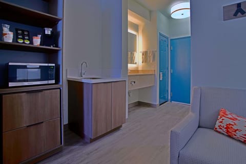 Desk, laptop workspace, blackout drapes, iron/ironing board