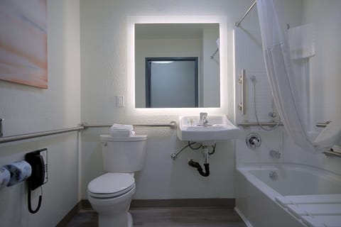 Desk, laptop workspace, blackout drapes, iron/ironing board