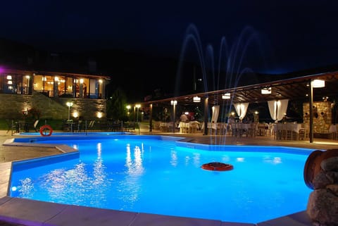 Seasonal outdoor pool, open 10:00 AM to 8:00 PM, pool umbrellas