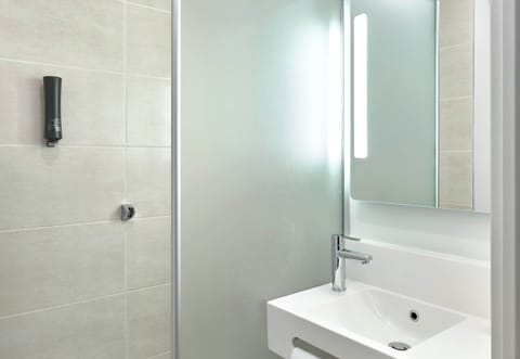 Shower, towels, soap, toilet paper