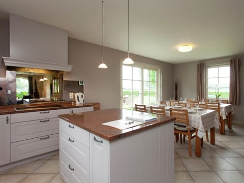 Villa | Private kitchen | Fridge, microwave, oven, highchair