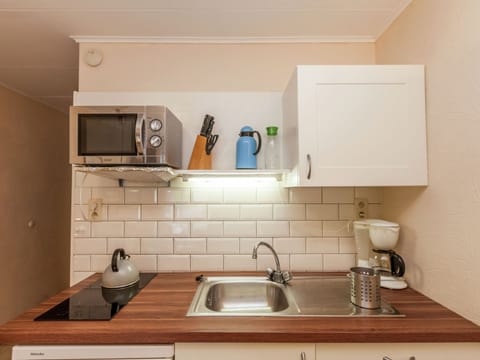 Apartment | Private kitchen | Stovetop, highchair