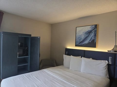 Premium bedding, desk, laptop workspace, blackout drapes