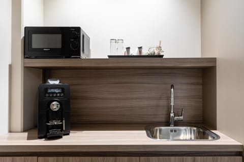 Business Room (Skybox) | Private kitchen | Coffee/tea maker, electric kettle, highchair