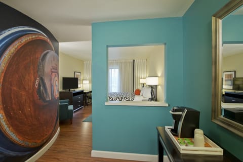 Premium bedding, desk, laptop workspace, blackout drapes