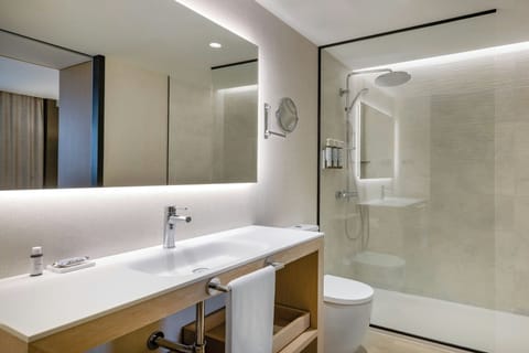 Combined shower/tub, designer toiletries, hair dryer, bathrobes