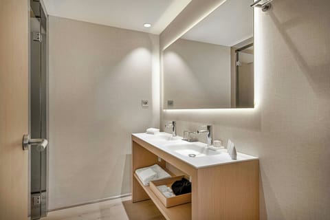 Combined shower/tub, designer toiletries, hair dryer, bathrobes