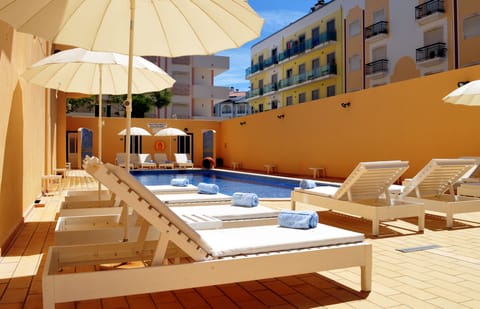 Outdoor pool, open 9:00 AM to 8:00 PM, pool umbrellas, sun loungers
