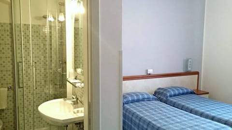 Twin Room | Bathroom | Shower, hair dryer, bidet, towels
