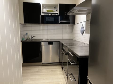Comfort Apartment | Private kitchen | Cookware/dishes/utensils, cleaning supplies
