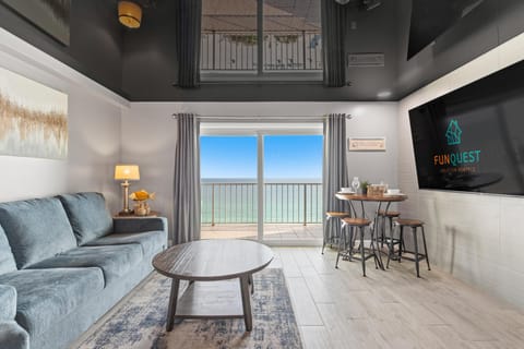 Condo, 1 King Bed with Sofa bed (The Summit 1217) | Living area | Flat-screen TV