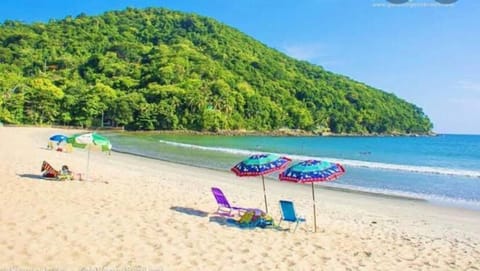 Beach nearby, white sand, beach umbrellas, beach towels