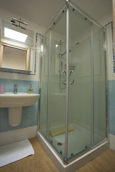 Shower, slippers, bidet, towels