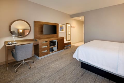 Desk, laptop workspace, blackout drapes, iron/ironing board