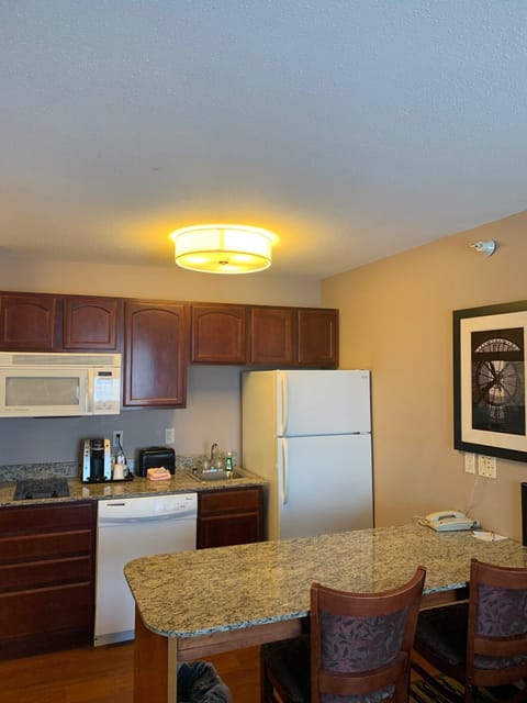 Suite, 1 Queen Bed | Private kitchen | Fridge, microwave, stovetop, dishwasher