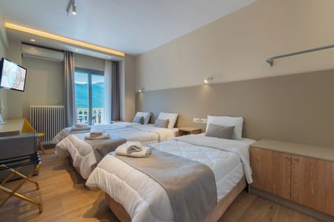 Family Triple Room, 3 Twin Beds, Non Smoking, Mountain View | In-room safe, soundproofing, iron/ironing board, free WiFi