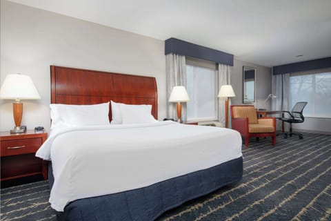 Premium bedding, desk, laptop workspace, iron/ironing board