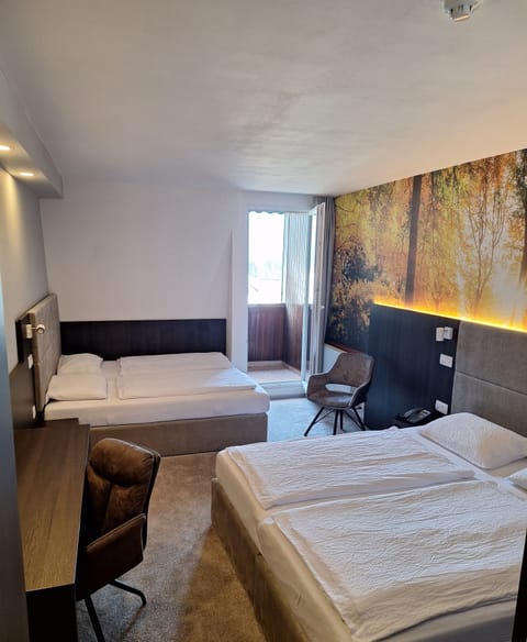 Quadruple Room | 1 bedroom, in-room safe, desk, blackout drapes