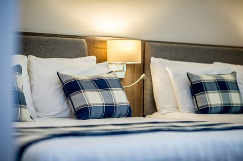 Family Room | Premium bedding, in-room safe, desk, iron/ironing board