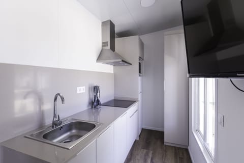 Fridge, stovetop, coffee/tea maker, cookware/dishes/utensils