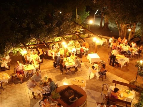 Lunch, dinner served; local cuisine, garden views 