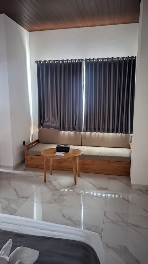 Family Studio Suite | Living area | 21-inch LED TV with satellite channels, TV