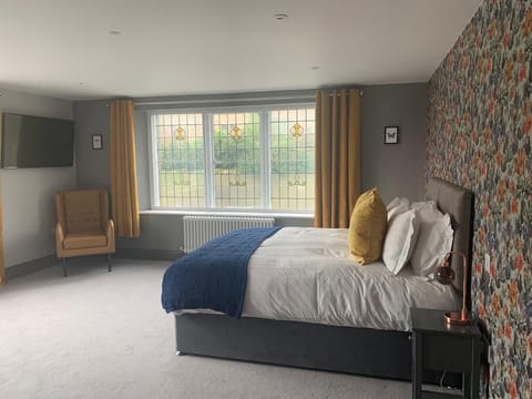 Desk, laptop workspace, blackout drapes, iron/ironing board