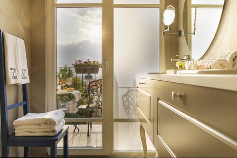 Designer toiletries, hair dryer, bathrobes, slippers