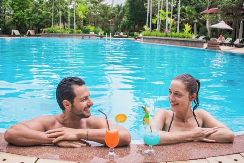 Outdoor pool, open 8:00 AM to 8:00 PM, pool umbrellas, sun loungers