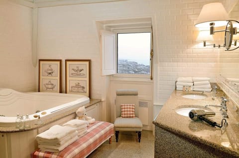 Suite, Sea View | Bathroom | Combined shower/tub, deep soaking tub, free toiletries, hair dryer