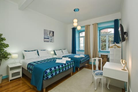 Deluxe Quadruple Room  with private toilet | Individually decorated, individually furnished, desk, laptop workspace