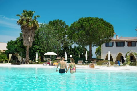 Seasonal outdoor pool, open 9:00 AM to 8:00 PM, pool umbrellas
