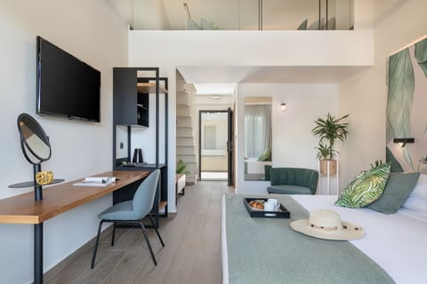 Junior Suite - Maisonette With Pool View | Living area | Flat-screen TV