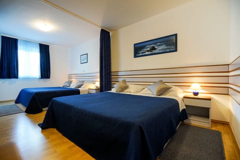 Family Quadruple Room, Balcony, Partial Sea View | In-room safe, desk, free WiFi, bed sheets