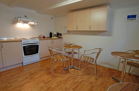 Full-size fridge, microwave, stovetop, coffee/tea maker