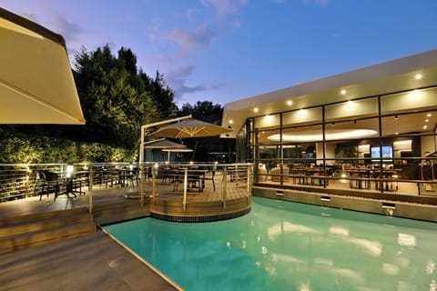 Outdoor pool, open 6 AM to 9 PM, pool umbrellas, sun loungers