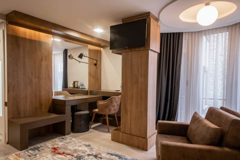 Deluxe Suite, City View, Corner | Premium bedding, minibar, in-room safe, individually decorated