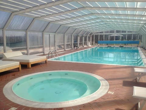 Indoor pool, outdoor pool, open 10:00 AM to 7:00 PM, pool umbrellas