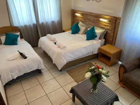 Family Room (Queen) | Blackout drapes, iron/ironing board, free WiFi, bed sheets