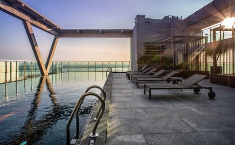 Outdoor pool, open 7:00 AM to 8:00 PM, sun loungers