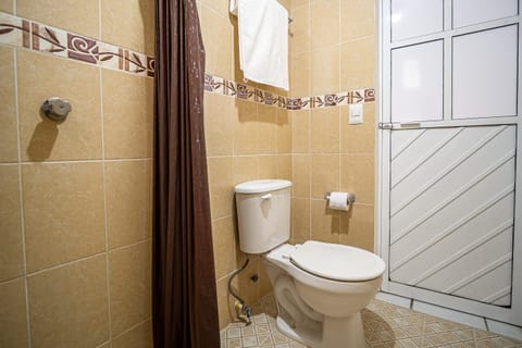 Standard Room, 2 Double Beds | Bathroom | Shower, towels, soap, shampoo
