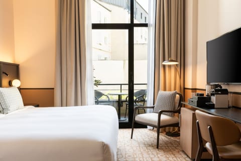 Premium bedding, down comforters, free minibar items, in-room safe